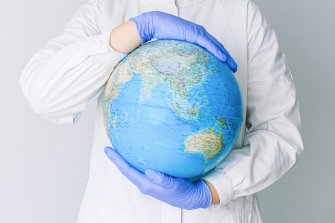 clinician holding globe