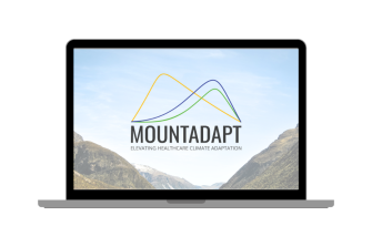 Laptop showcasing MOUNTADAPT logo and mountains in the background