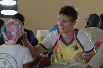 Health professional cares for patient at a public health clinic