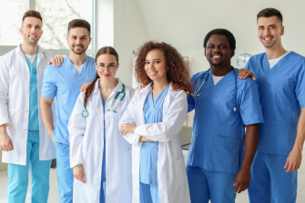 Group of health professionals standing proudly
